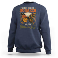Navy crewneck sweatshirt with monarch butterfly graphic on chest, long sleeves