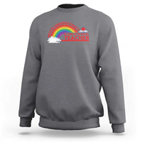 Dark heather gray crewneck sweatshirt with “Never Underestimate” rainbow teacher graphic