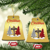 Gold bell-shaped Christmas ornaments with “Christmas begins with Christ” plaid cross design