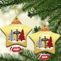Two gold star-shaped Christmas ornaments with “Christmas begins with Christ” plaid cross artwork