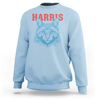 Light blue sweatshirt with 'HARRIS' text and blue cat face graphic