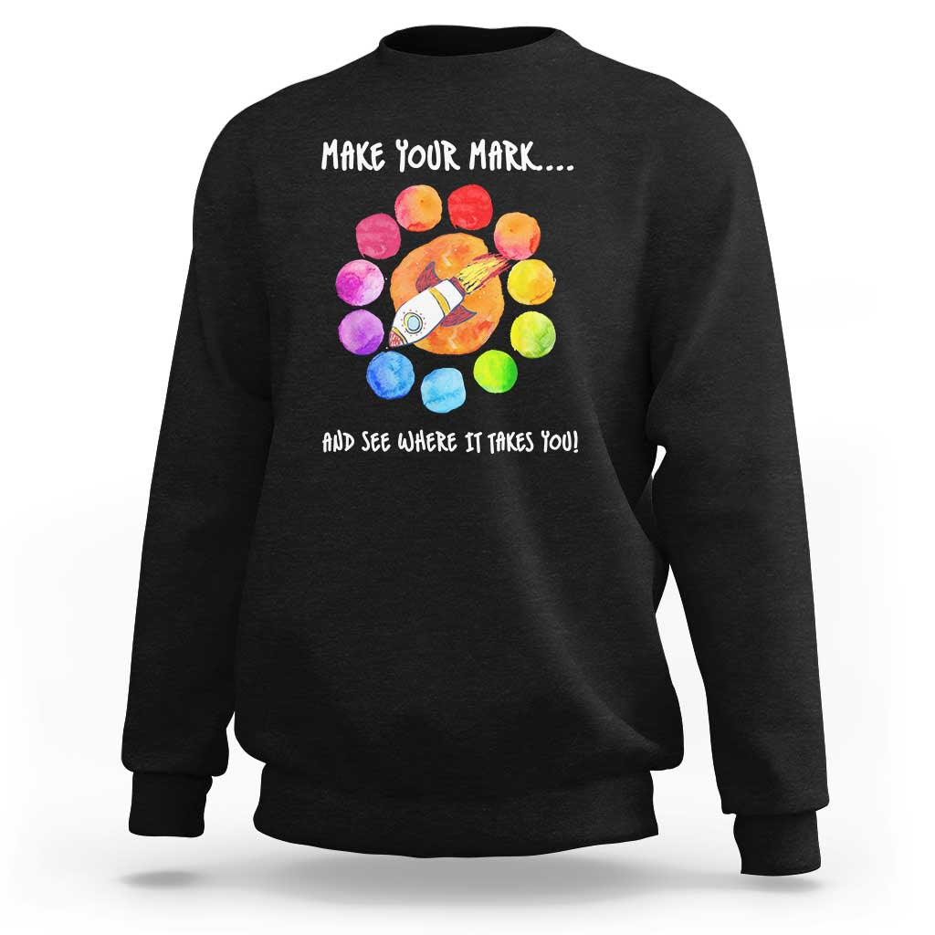 Black crewneck sweatshirt with colorful dot rocket graphic on the back
