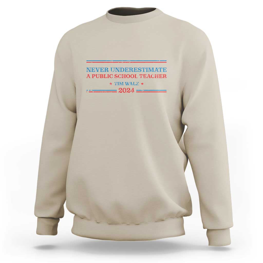 Beige crewneck sweatshirt with Never Underestimate teacher graphic on chest