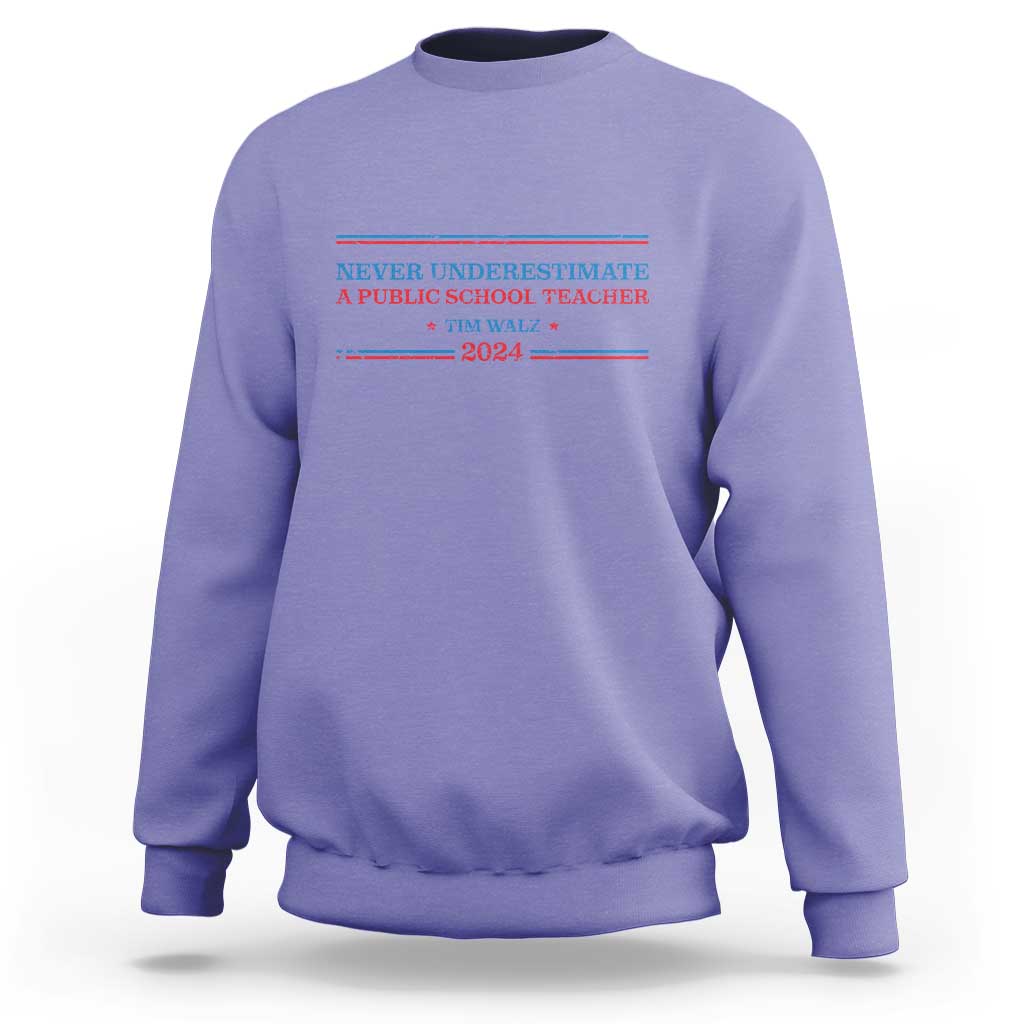 Violet crewneck sweatshirt with Never Underestimate teacher graphic on chest