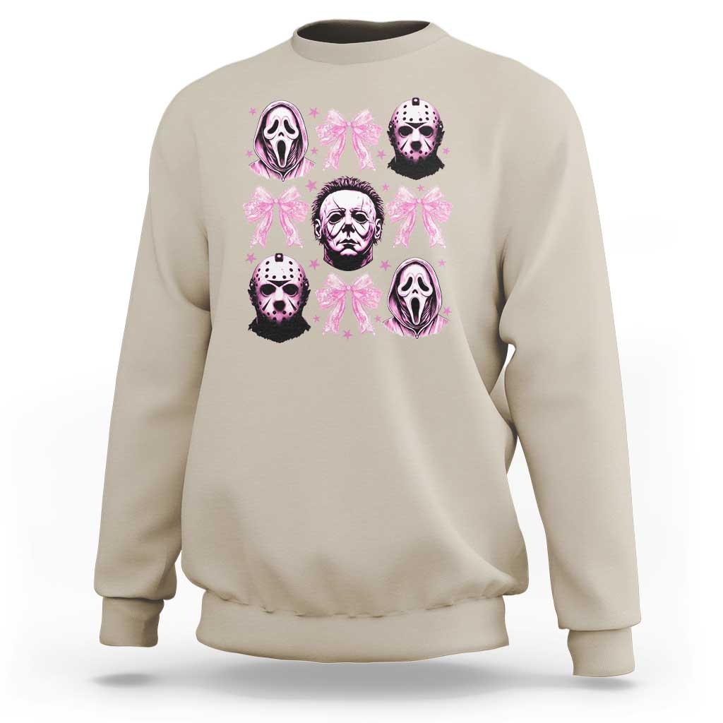 Sand sweatshirt with pink bow graphic and skull faces on the front