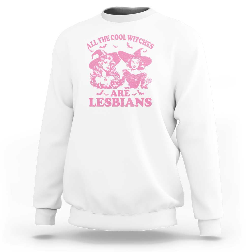 White crewneck sweatshirt with pink witch graphic and “Lesbians” text