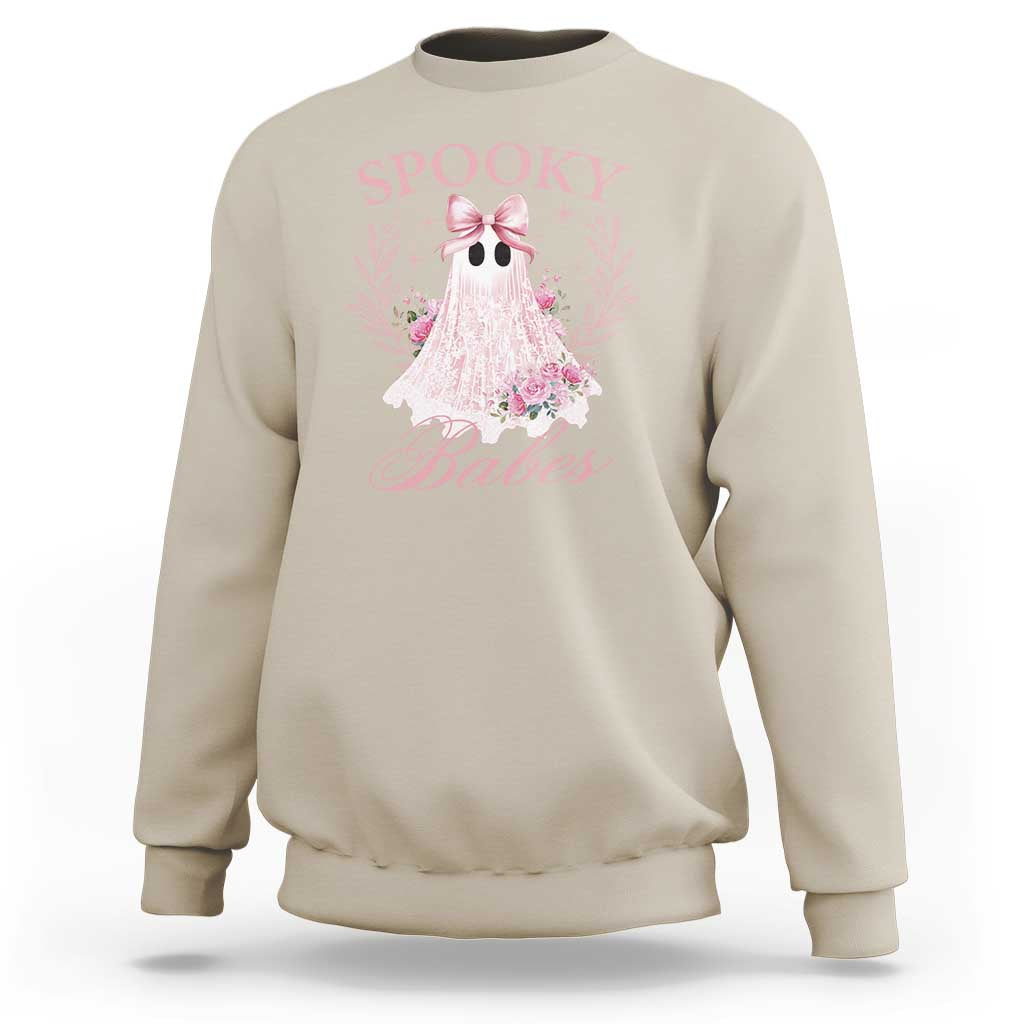 Sand Halloween sweatshirt with pink ghost graphic, bow, and floral accents on front.