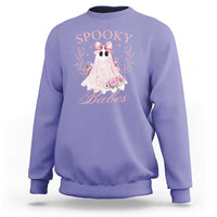 Violet Halloween sweatshirt with pink ghost graphic, bow, and floral accents on front.