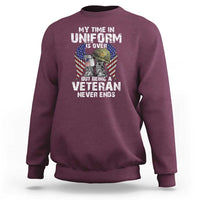 Maroon veterans sweatshirt with front graphic text and veteran eagle flag design