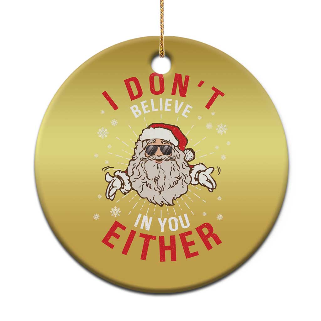 Gold round Santa Christmas ornament with “I DON’T BELIEVE IN YOU EITHER” text