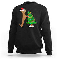 Black wiener dog Christmas sweatshirt with Santa hat and decorated tree graphic