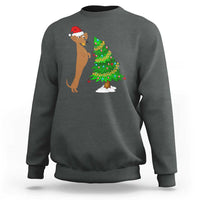 Dark heather gray wiener dog Christmas sweatshirt with Santa hat and decorated tree graphic
