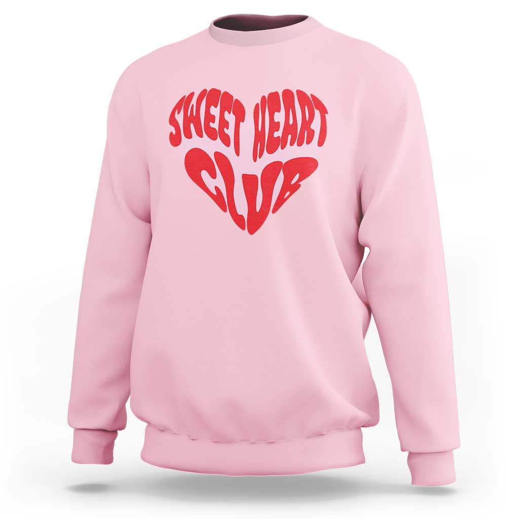 Light pink crewneck sweatshirt with red “Sweet Heart Club” heart graphic on chest