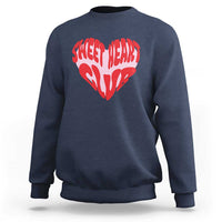 Navy crewneck sweatshirt with red “Sweet Heart Club” heart graphic on chest