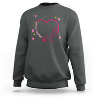 Dark heather crewneck sweatshirt with pink heart stethoscope graphic and multicolor hearts