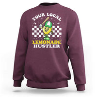 Maroon crewneck sweatshirt with 'Lemonade Hustler' front graphic