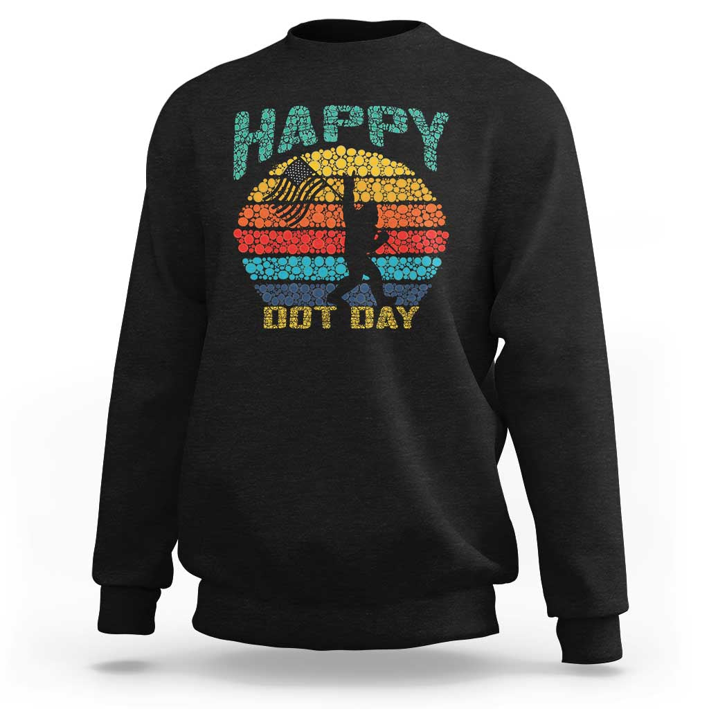 Black crewneck sweatshirt with “Happy Dot Day” Bigfoot graphic in retro sunset dots