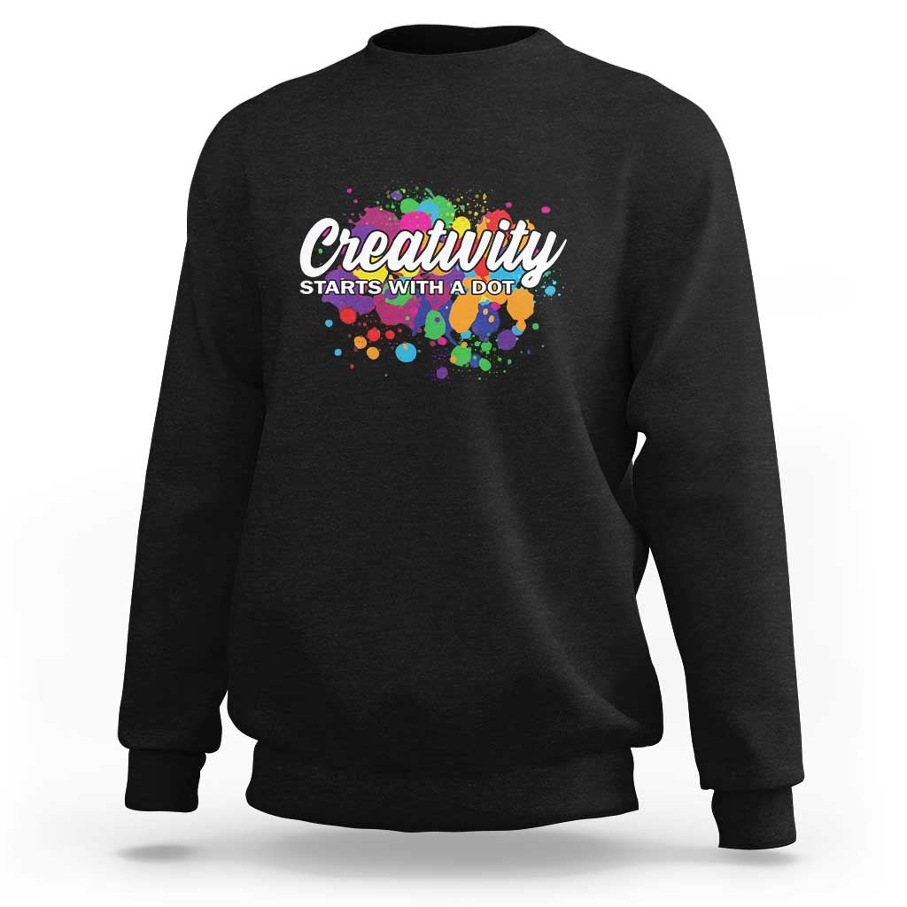 Charcoal black sweatshirt with colorful dots and "Creativity starts with a dot" front graphic