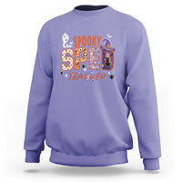 Lavender crewneck sweatshirt with colorful spooky 2 teacher graphic