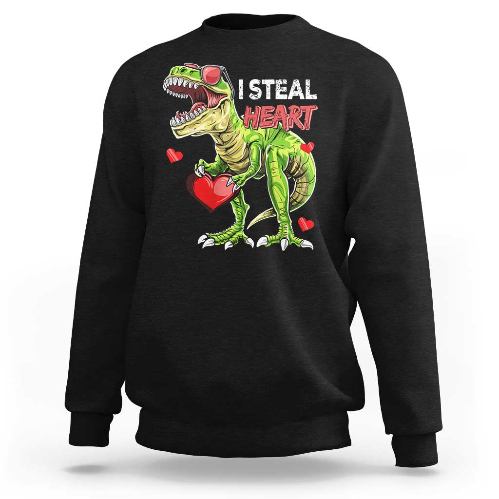 Black sweatshirt with cartoon dinosaur holding a red heart and “I STEAL HEARTS” print