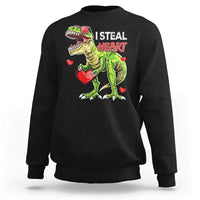 Black sweatshirt with cartoon dinosaur holding a red heart and “I STEAL HEARTS” print