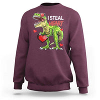 Maroon sweatshirt with cartoon dinosaur holding a red heart and “I STEAL HEARTS” print