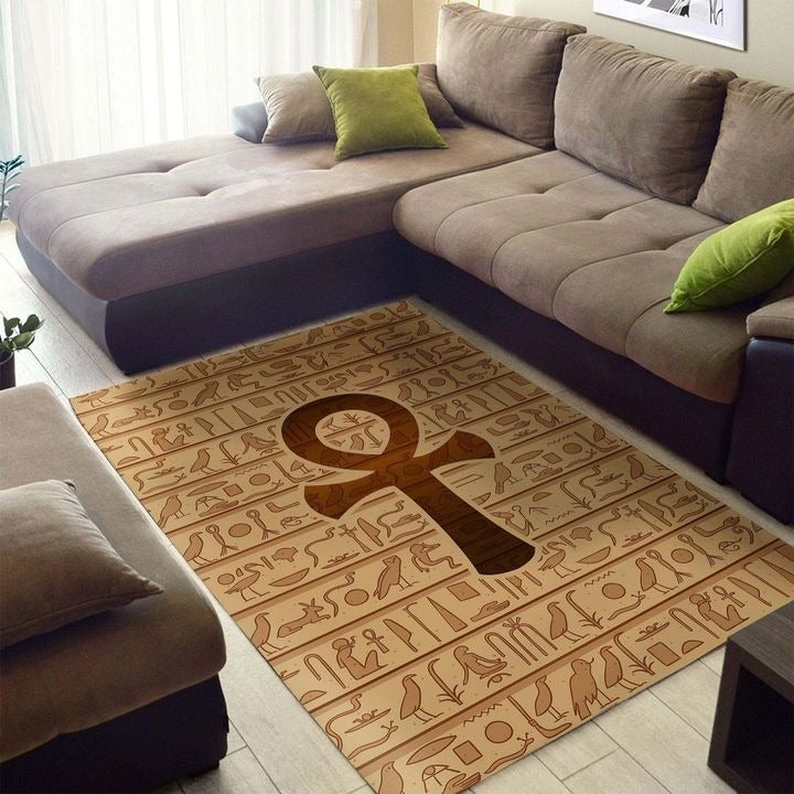 Brown area rug with African ankh symbol and Egyptian-style hieroglyph pattern