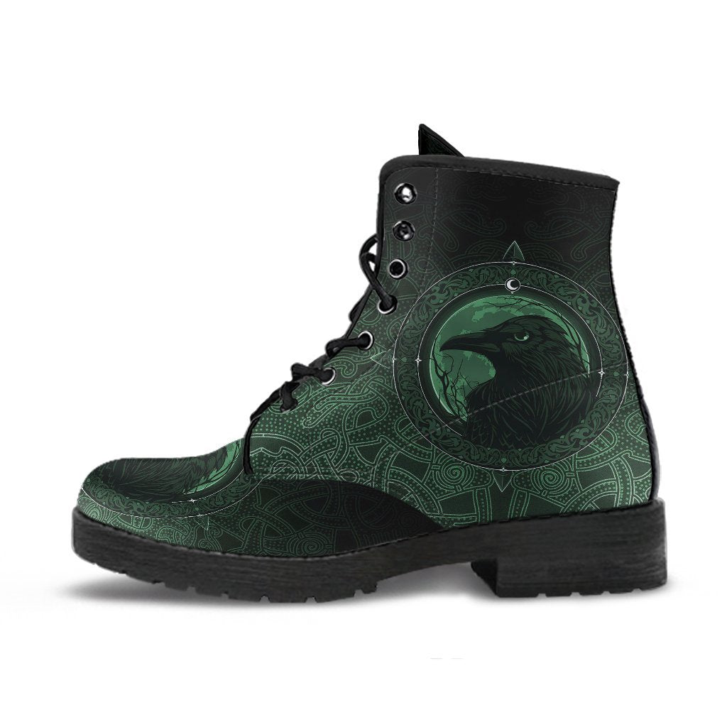 Green patterned lace-up ankle boots with black collar and raven emblem