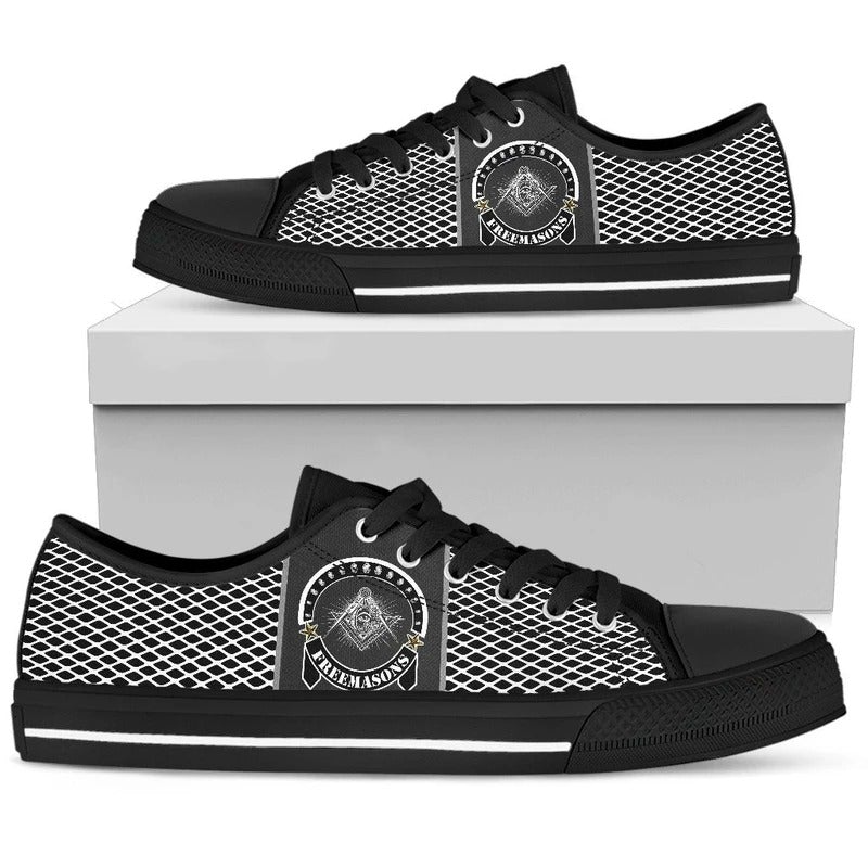 Black low-top sneakers with white mesh side panels and circular emblem logo