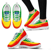 Pair of Ethiopia sneakers with tricolor panels, white sole, blue crest on tongue