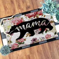 Floral doormat with black bear silhouette and script name, dark border