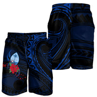 Blue Polynesian wave swim shorts with floral emblem and elastic waistband (set view).