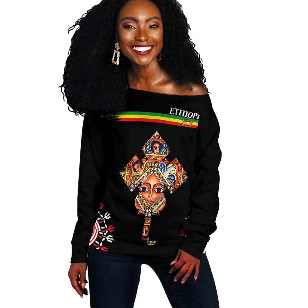Black off-shoulder sweater with Ethiopia multicolor graphic, long sleeves