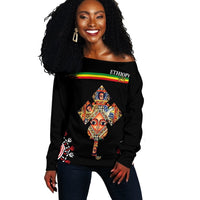 Black off-shoulder sweater with Ethiopia multicolor graphic, long sleeves