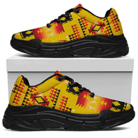 Yellow chunky sneakers with Native-style tribal pattern, black laces and black sole