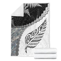 White premium blanket with black fern and Maori pattern, folded in gift set