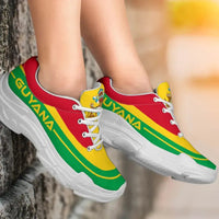 Guyana flag chunky sneakers, red and yellow upper with green stripes; white laces, white sole