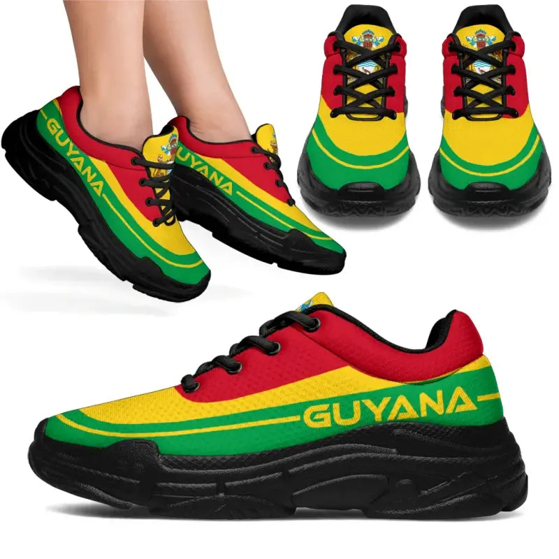Front and side views: Guyana flag chunky sneakers, black sole, red/yellow/green colors, black laces