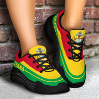 On-foot view of Guyana flag chunky sneakers; black sole, red/yellow/green upper with black laces