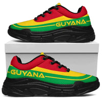 Guyana flag chunky sneakers on white box; black sole, red-yellow-green upper, black laces