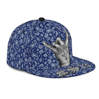 Blue snapback hat side view with paisley bandana print and gray hand graphic