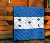 Blue and white star quilt with white stripe and diamond stitching