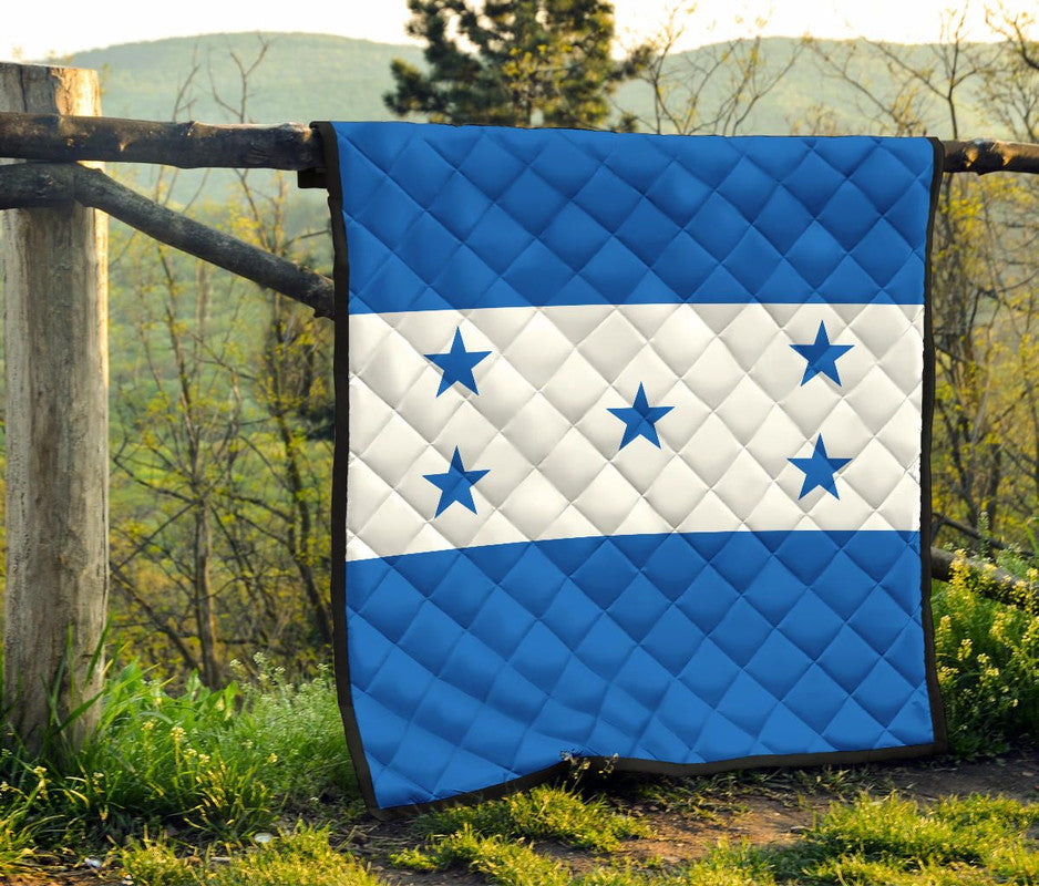 Blue and white diamond-quilted star blanket with flag-style bands