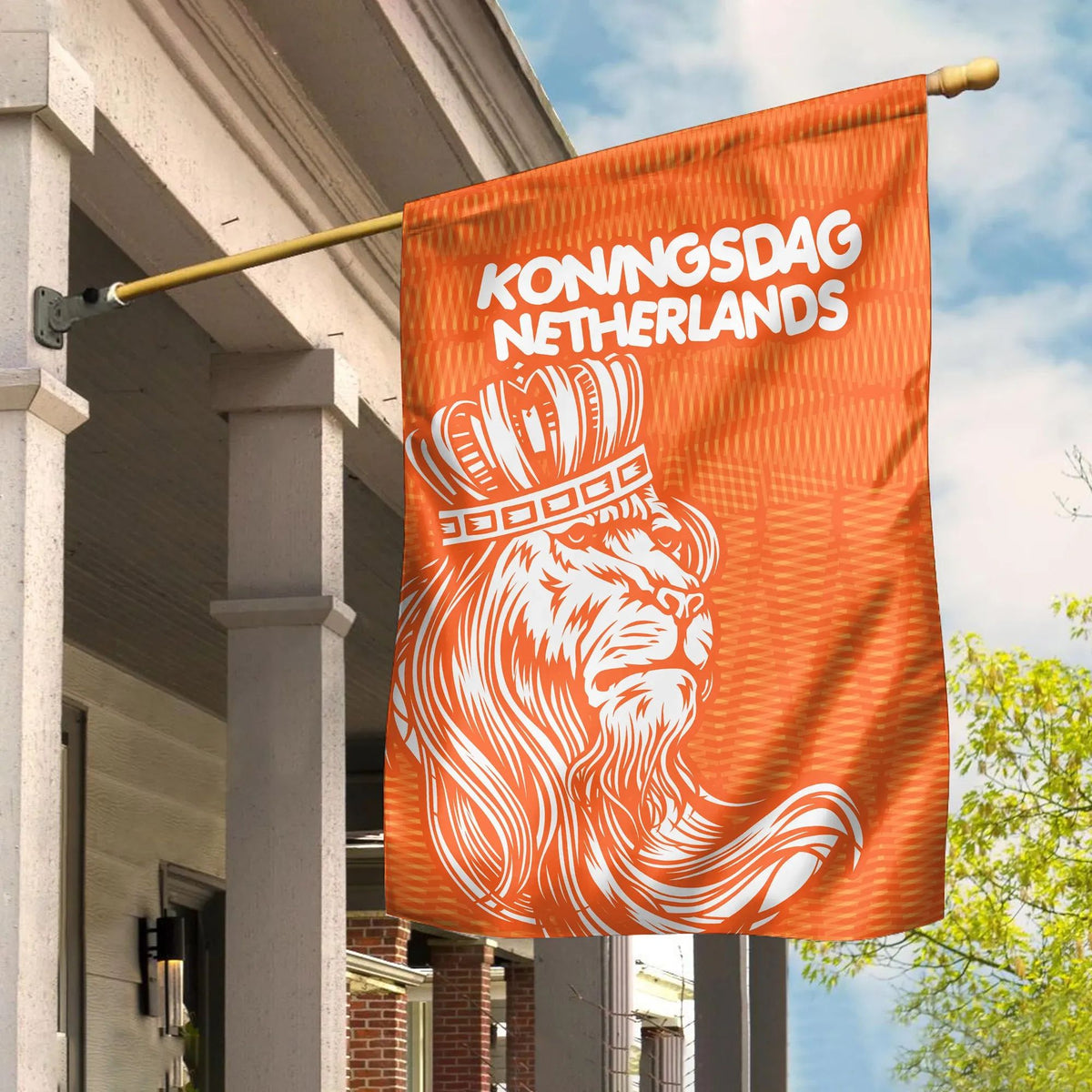Orange Koningsdag Netherlands flag with lion graphic and text, mounted on pole