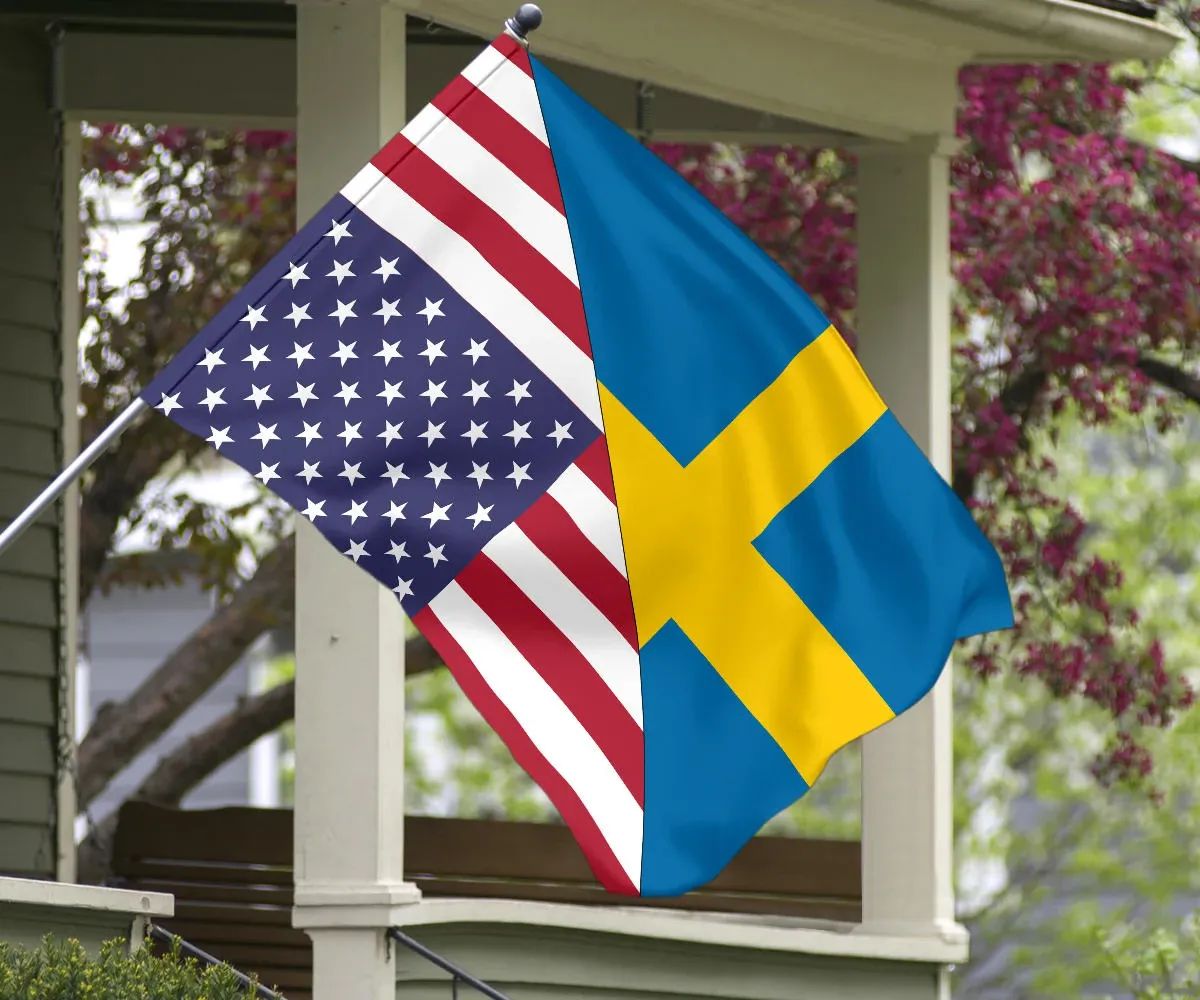 Flag hanging on a porch post with US stripes and stars and Sweden blue-yellow cross