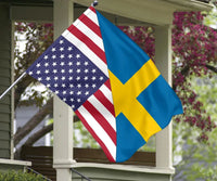 Flag hanging on a porch post with US stripes and stars and Sweden blue-yellow cross