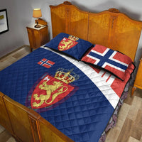 Quilt bed set with blue quilt and two pillows; red crown lion crest and white cross