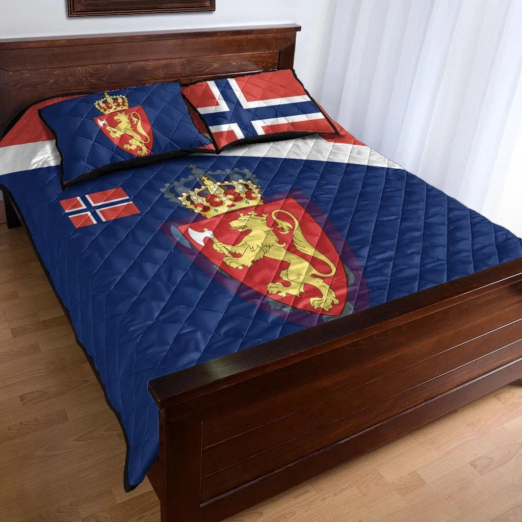 Blue quilt with lion crest, red/white cross and striped panel; matching pillow