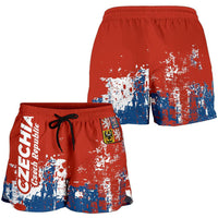 Red smudge-print shorts, blue-and-white graphic at hem, elastic waistband, back view