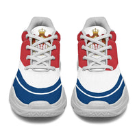 Pair of chunky sneakers with red uppers, white laces, blue heel accent, white sole